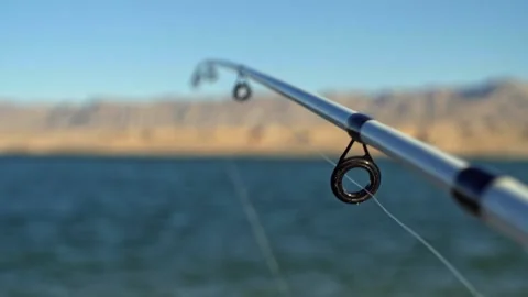 Pull focus between eyes of a fishing rod Stock Footage 137994899