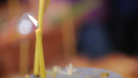Pull Focus of a candle burning in slow motion Stock Footage 84306399