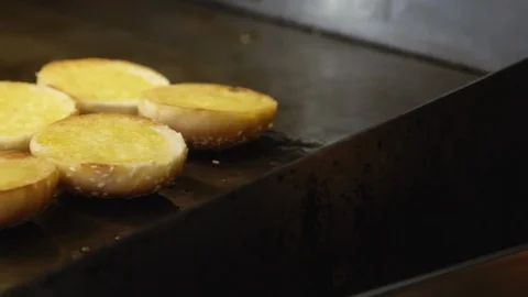 Pull focus from crispy bread buns to cooked meatballs Stock Footage 91371478