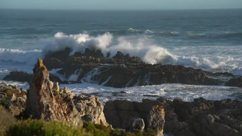 Pull focus footage of Atlantic Ocean waves breaking onto rocks. Stock Footage 306839969