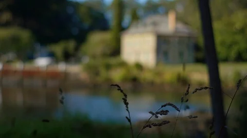 Pull focus Heritage building beside lake Stock Footage 88603877