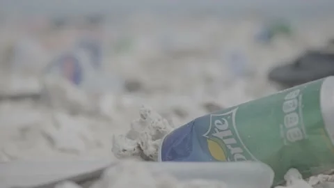 Pull Focus of Plastic Polluion and Sprite Can Stock Footage 159135093