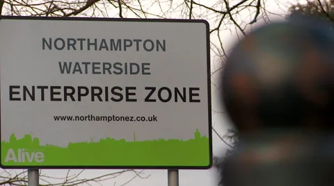 Pull Focus From Post to Northampton Enterprise Sign Stock Footage 61636349