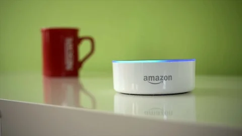 A Pull Focus Shot of Amazon Dot Activating Its Light Stock Footage 89625210