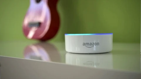Pull Focus Shot of Amazon Dot Activating Its Light Stock Footage 89626963