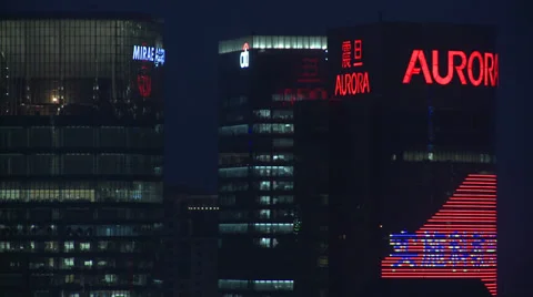 Pull focus off skyscrapers at night Stock Footage 37886068