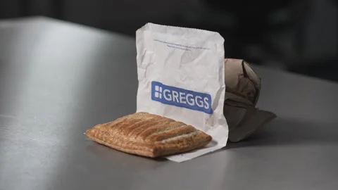 Pull focus to a steak bake pie from greggs. Stock Footage 280668796