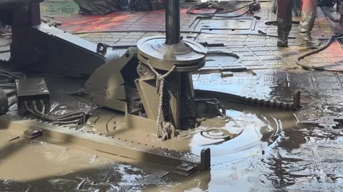 Pull of of hole drill string with oil based mud on the rig floor. Stock Footage 323360622