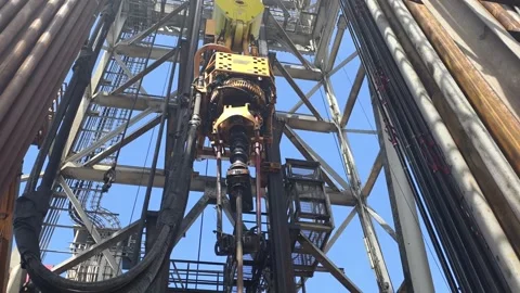Pull of of hole drill string with oil based mud on the rig floor. Stock Footage 340931782