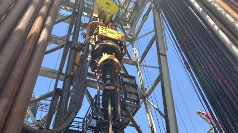 Pull of of hole drill string with oil based mud on the rig floor. Stock Footage 340931783