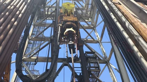 Pull of of hole drill string with oil based mud on the rig floor. Stock Footage 340931786
