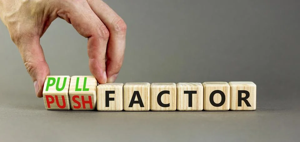 Pull or push factor symbol. Concept word Pull factor and Push factor on woo.. Stock Photos