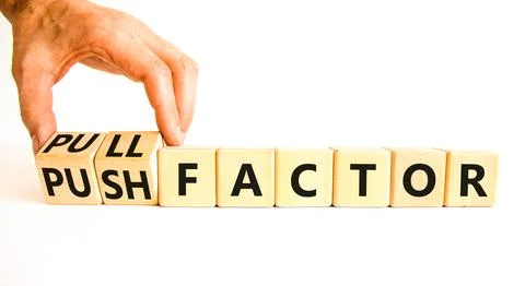 Pull or push factor symbol. Concept word Pull factor and Push factor on woo.. Stock Photos