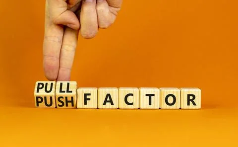 Pull or push factor symbol. Concept word Pull factor and Push factor on woo.. Stock Photos