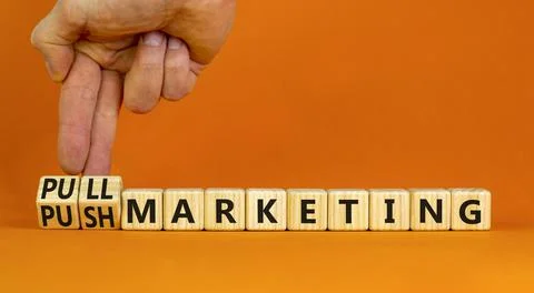 Pull or push marketing symbol. Businessman turns cubes and changes concept wo Stock Photos