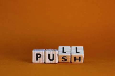 Pull or push symbol. Turned wooden cubes and changed the word 'push' to 'pull Stock Photos