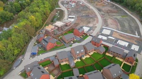 Pull out aerial view of a small new housing estate construction site Video stock 317490873