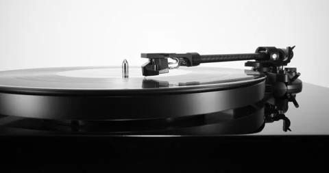 Pull-out with black turntable with spinning vinyl record on Stock Footage 155859811