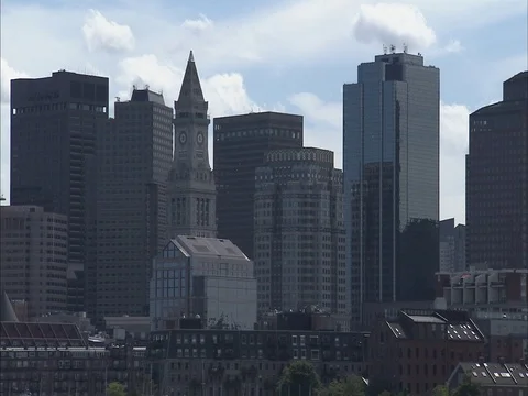 Pull out from Boston Skyline to Boston Harbor on overcast day Stock Footage 86750331