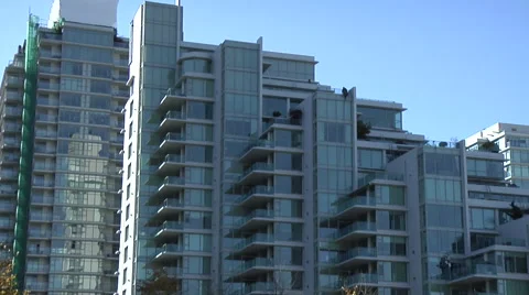 Pull out from condominium apartment building revealing marina in foreground Stock Footage 53051550