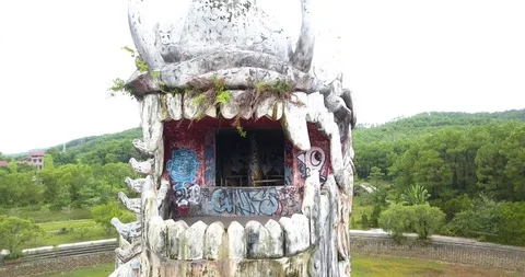 Pull out drone shot of giant abandoned dragon statue in Hue Vietnam Stock Footage 97427474