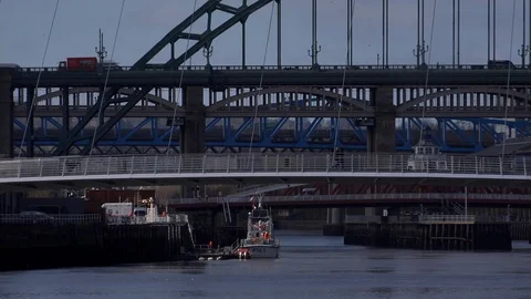 Pull out shot Newcastle upon Tyne bridges across the Tyne river UK 4K Stock Footage 105358324