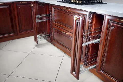 Pull out spice rack cabinet filler pantry. Two vertical drawers for spices sh Stock Photos