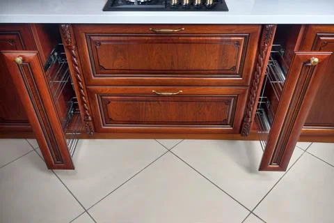 Pull out spice rack cabinet filler pantry. Two vertical drawers for spices shelf Stock Photos