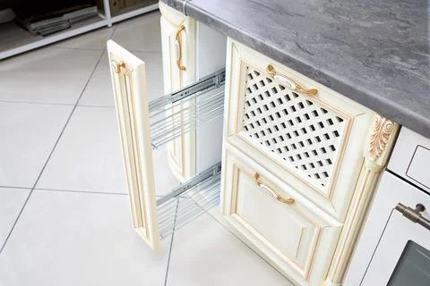 Pull out spice rack cabinet filler pantry. Mmodern kitchen interior in classic Stock Photos