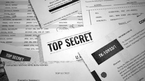 Pull out from Top Secret stamp on report to various classified looking documents Stock Footage 310856826