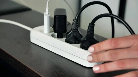Pull the plug from the extended socket at home Stock Footage 132633112