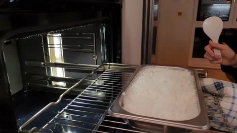 Pull rice out of the steam oven Stock Footage 159141754