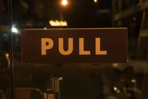 Pull sign board on a glass door Stock Photos