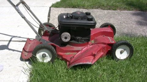 Pull starting mower in Fast Forward Stock Footage