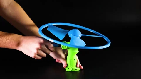 Pull String Flying Toy Demonstration Video stock 292952733
