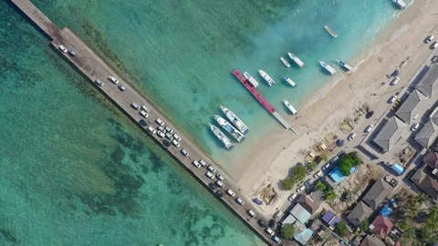 Pull Up Top Down Drone Shot of Cars Entering Nusa Penida Island via Toya Pake Stock Footage 113968980