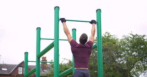 Pull Ups on High Bar at Street Workout Playground 動画素材 81971757