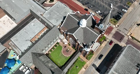 Pull viewing large church with multiple building additions on edge downtown Stock Footage 335673106