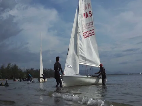 Pull yacht to shore Stock Footage 124830389
