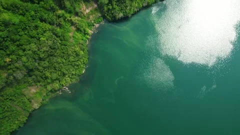 Pullback aerial reveal of tropical mountain terrain and coastal clear and clean Видео 336705356