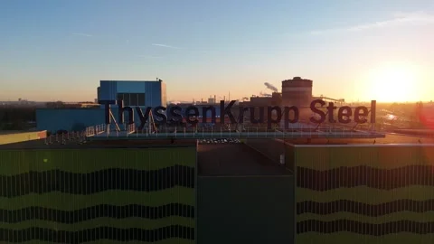 Pullback from close steel sign to factory skyline Stock-Footage 331202095