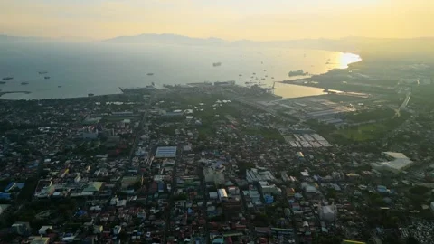 Pullback drone reveal of housing developments and city landscapes in Batangas Stockbeeldmateriaal 337148678