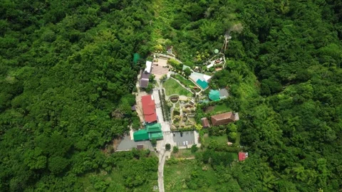 Pullback drone reveal of Imeldas Garden Resort around Cuenca Batangas Видео 336722278