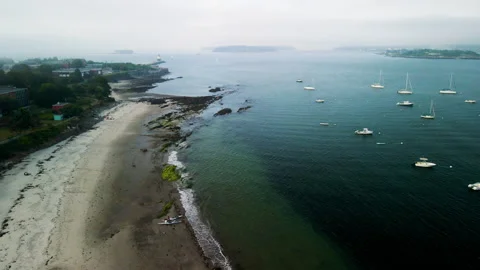 Pullback Drone Shot of Foggy Atlantic Bay with Boats – Portland, Maine – 4K 30fp Stock-Footage 313858341
