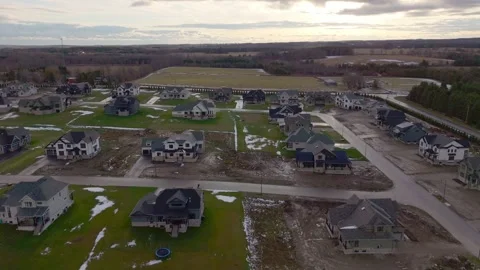 Pullback Drone Shot Of Houses In A New Neighbourhood Construction Project In Vídeos de archivo 326664962