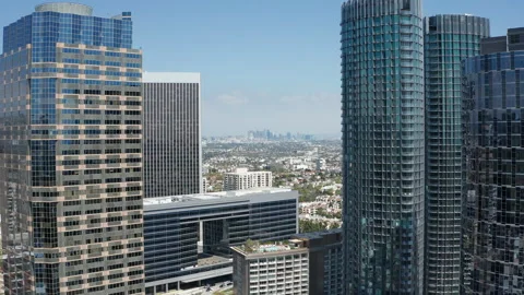 Pullback establishing shot of Century City downtown buildings and LA skyline Stock Footage 274012964
