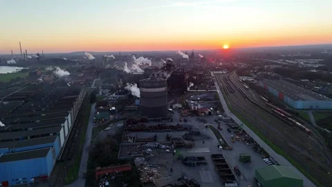 Pullback over riverfront industry toward distant plant Video stock 333061938