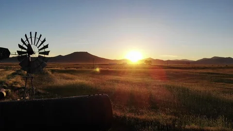 Pullback Past Old Windmill on Farm - Aerial Drone Stock Footage 114109921