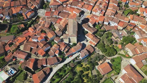 Pullback Reveal From Acebo Church Over Village and Hills Stock Footage 336560915