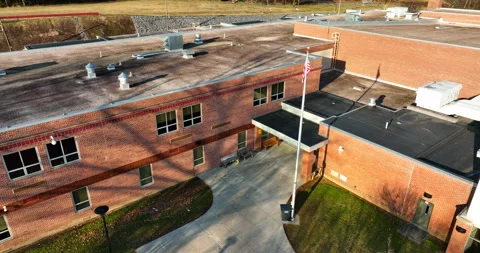 Pullback reveal of American school building exterior. Classrooms, USA Stock Footage 171281052